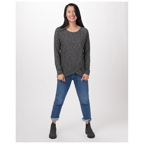 Woman wearing a Ten Tree Arce long-sleeve shirt in grey, paired with jeans and boots. Sustainable casual style.