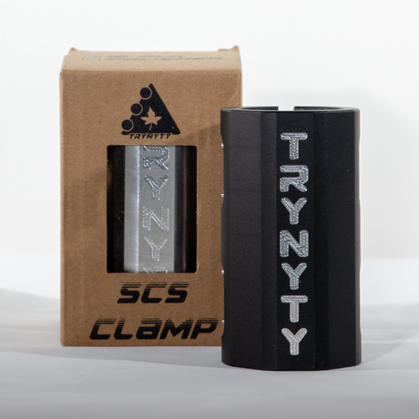 The Trynyty SCS clamp uses only the strongest bolts to keep your clamp and compression tight without having a heavy lug of a clamp to throw off your weight balance on the front end of your scooter. Cut outs to reduce weight without going over board keep the look clean and slick.  TRYNYTY SCS Clamp Colour: Black Picture Position: upright front facing (with box)  TRY-SCS-BK